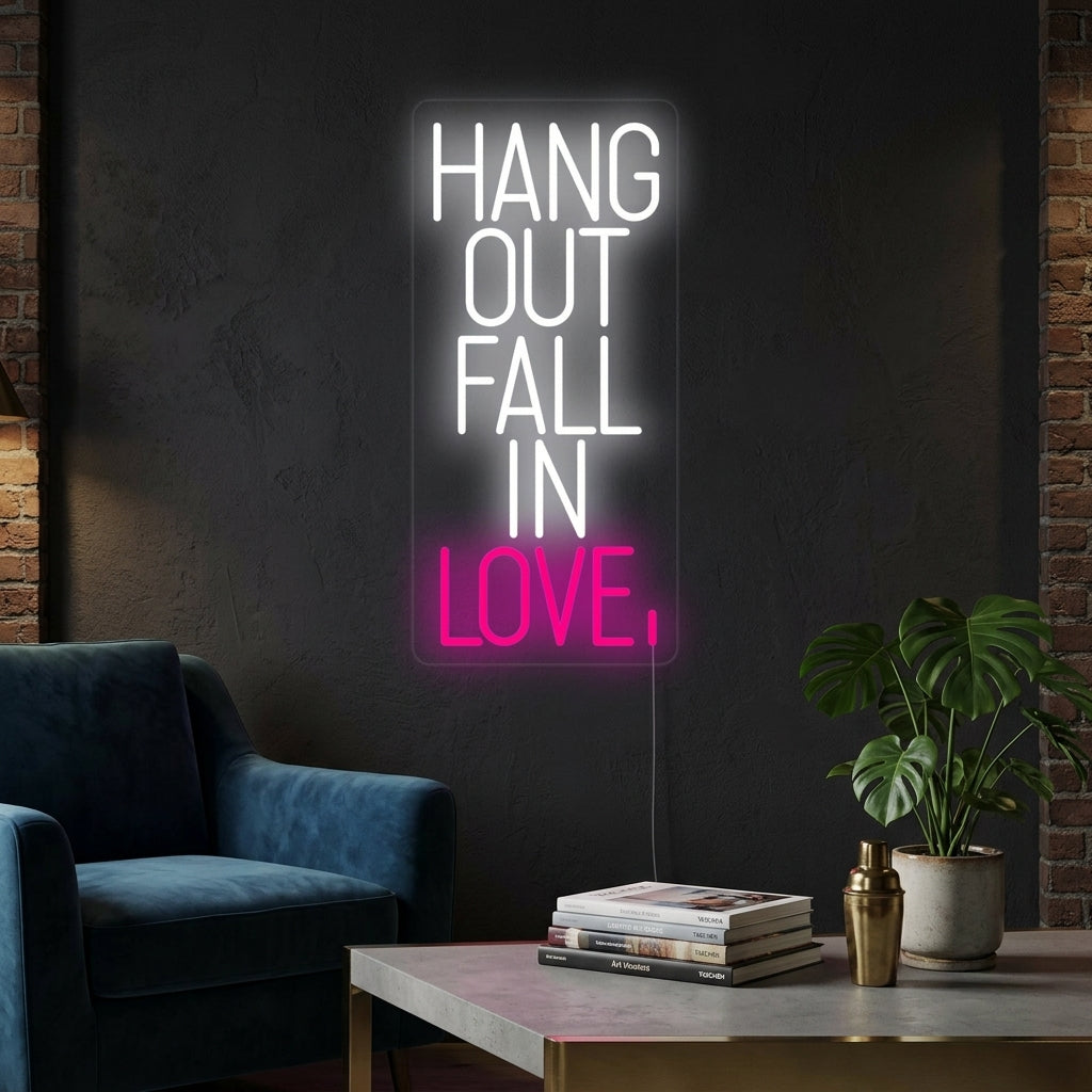A glowing 'Hang Out Fall In Love' neon sign in a contemporary living room setting.