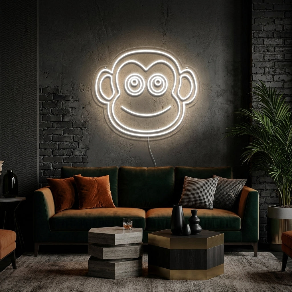 A vibrant 'Monkey Face' neon sign glowing brightly on a contemporary living room wall above a sofa.