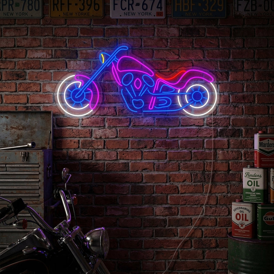 A close-up photograph of a dynamic 'Motorbike' neon sign with an iconic motorcycle silhouette, glowing brightly as part of stylish garage or workshop wall decor.