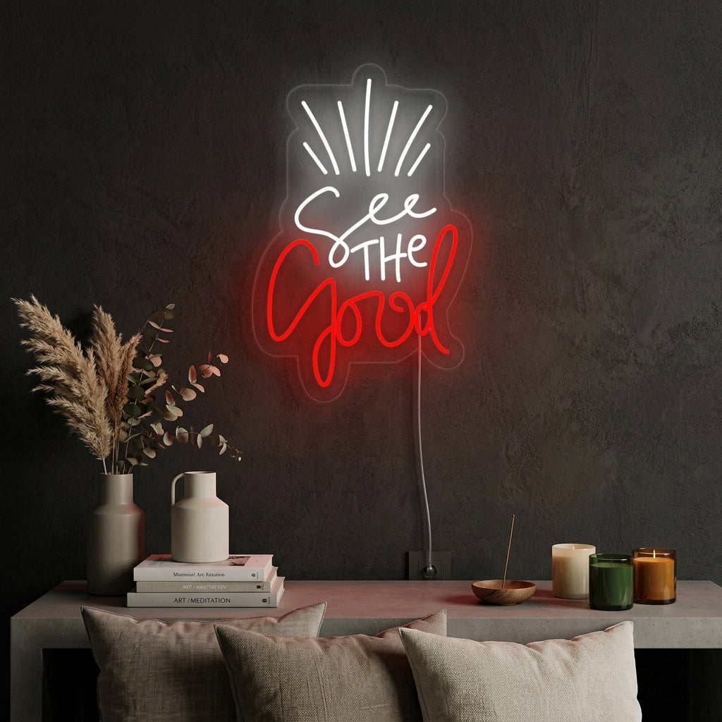 A lifestyle shot of the 'See The Good' neon sign glowing on a wall.