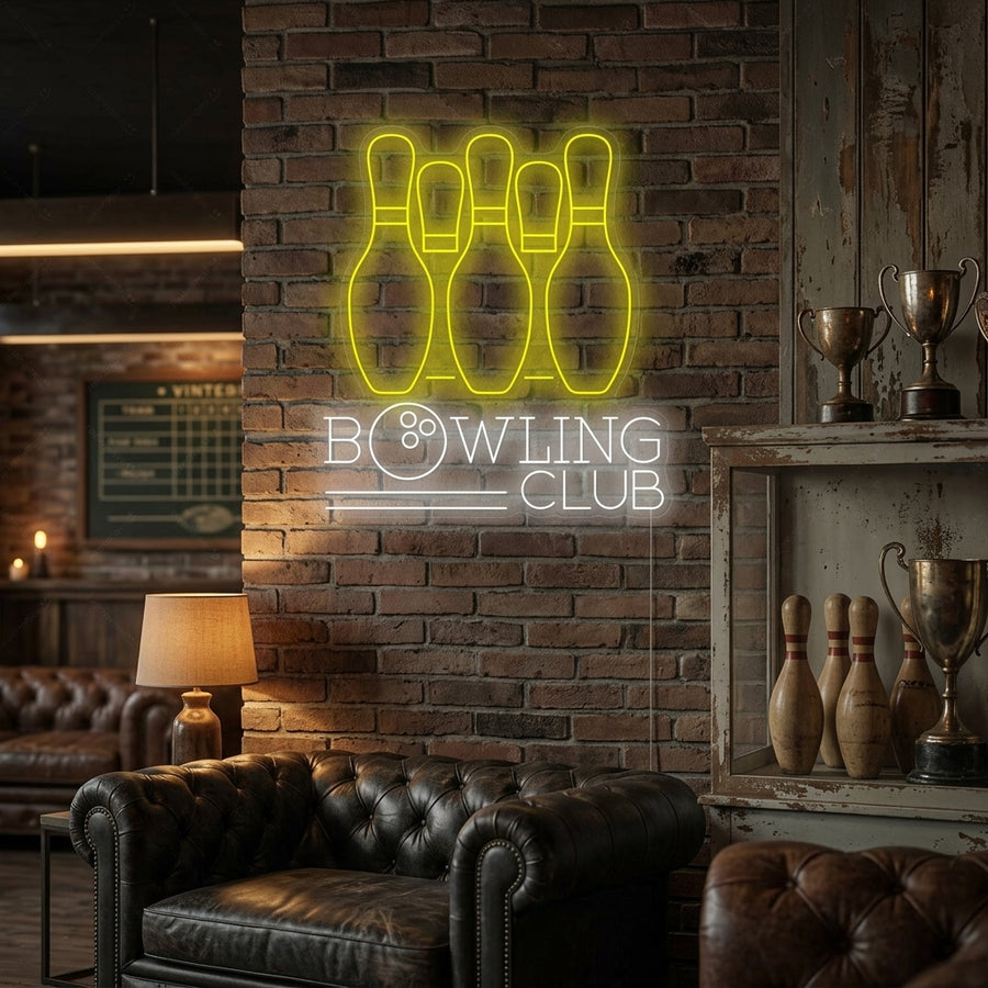 A vibrant 'Bowling Club' neon sign with text and graphics mounted on a textured brick wall in a lifestyle setting.
