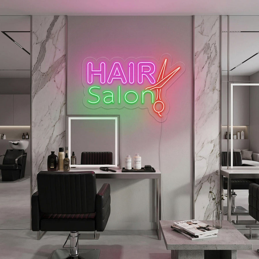 A bright, illuminated neon sign displaying the text 'HAIR SALON' in an upscale salon environment.