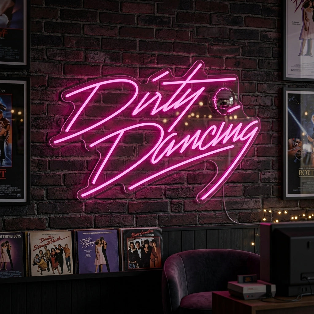 Glowing orange and pink Dirty Dancing script neon sign displayed on a moody, dark exposed brick wall in a cozy living room, creating an 80s movie vibe. High quality lifestyle product shot.