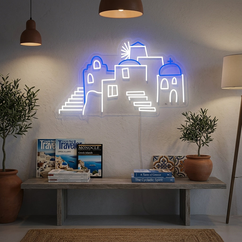 Handmade neon sign depicting the blue domes and white buildings of Santorini, Greece, hanging on a wall in a contemporary living room.