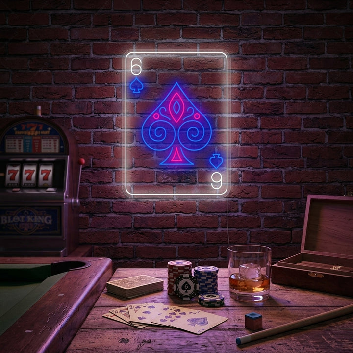 Poker 6 Neon Sign lit up above a rustic wooden bar in a dimly lit room.