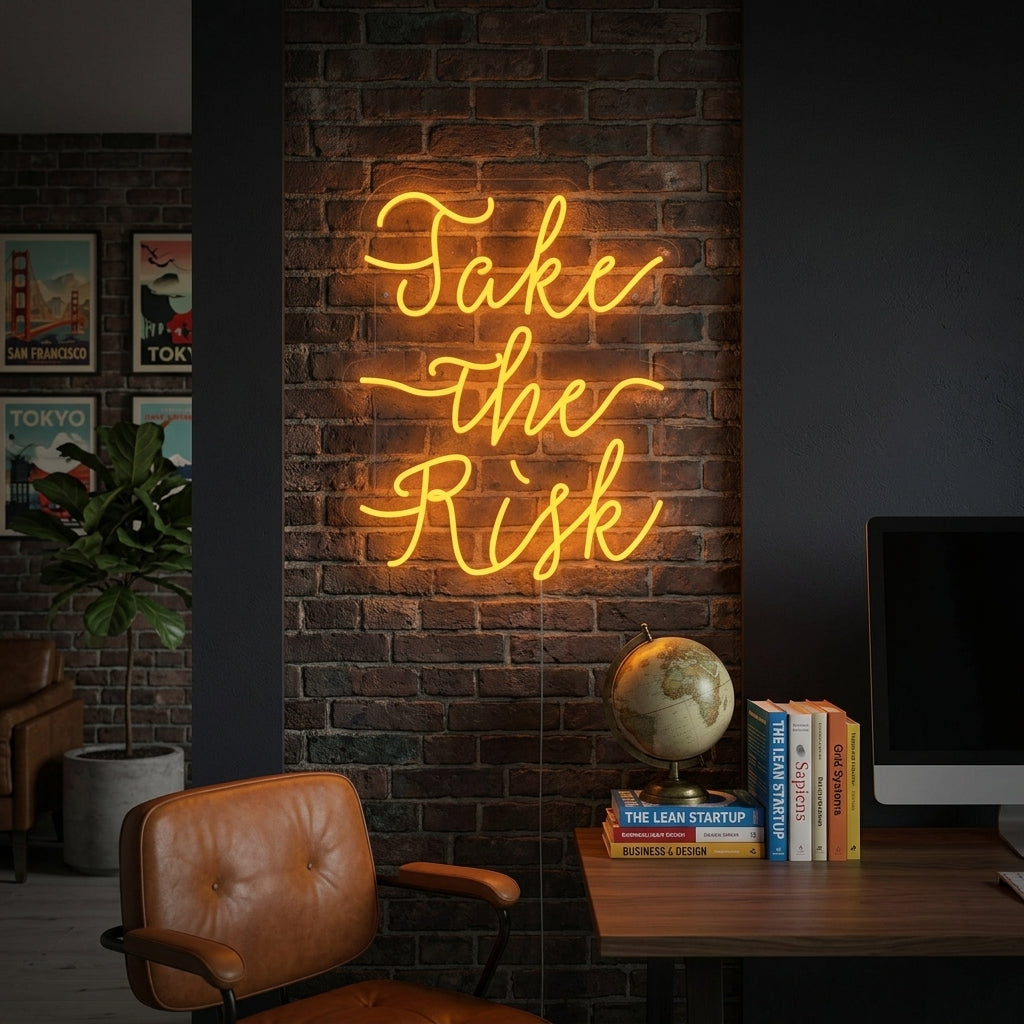 A lifestyle shot of the lit 'Take The Risk' neon sign glowing on a textured brick wall in a cozy room.