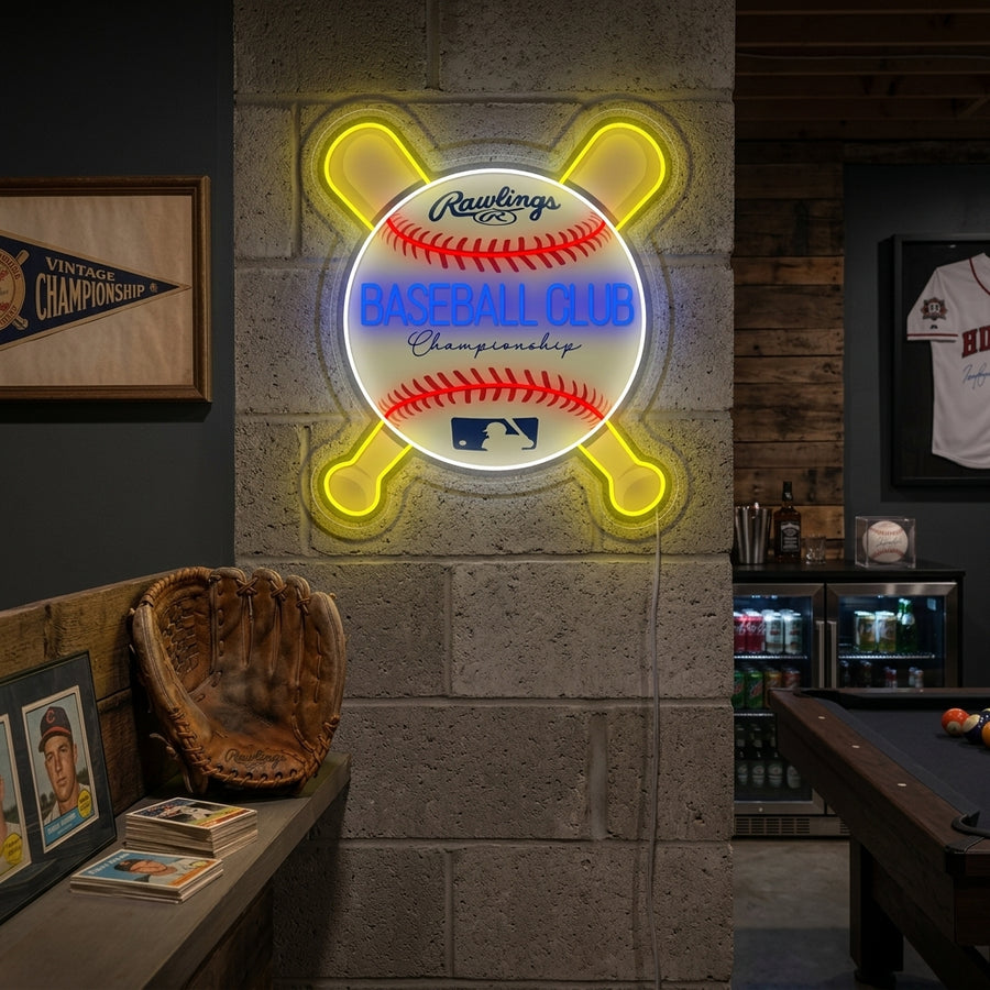A illuminated Baseball Club neon sign featuring red script text and a white baseball, mounted on a brick wall above a sofa with a blurred baseball glove and ball in a cozy living room setting.