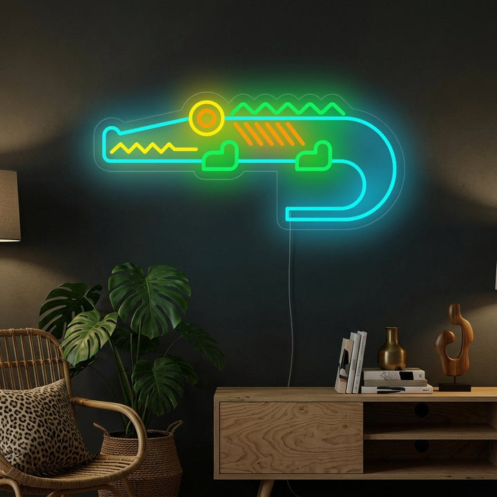 A glowing 'Cute Crocodile' neon wall sign mounted above a shelf in a stylized kid's room or playroom, creating a warm, playful atmosphere.