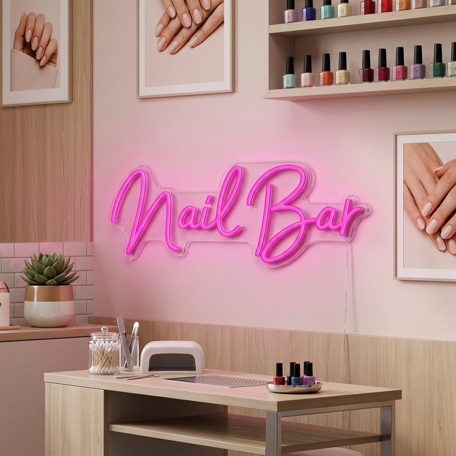Lifestyle image of a stylish 'Nail Bar' neon sign glowing brightly on a brick wall in a modern beauty salon context.