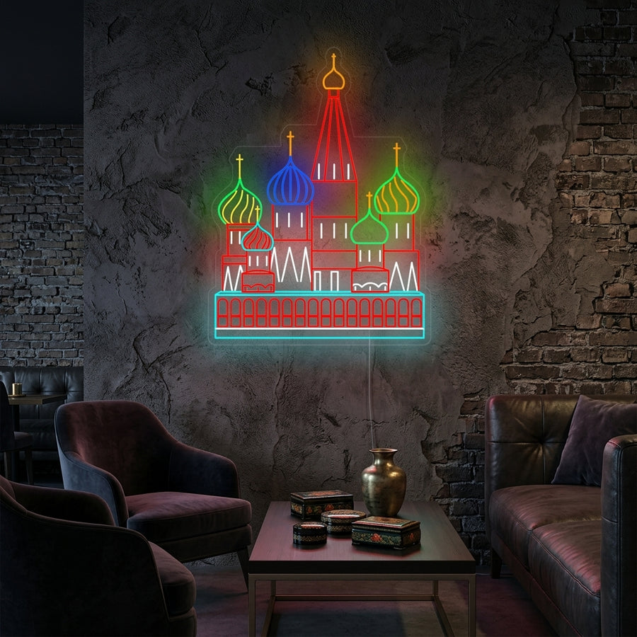 A lifestyle shot of the illuminated Moscow Kremlin neon sign glowing on a textured living room wall above a modern sofa.
