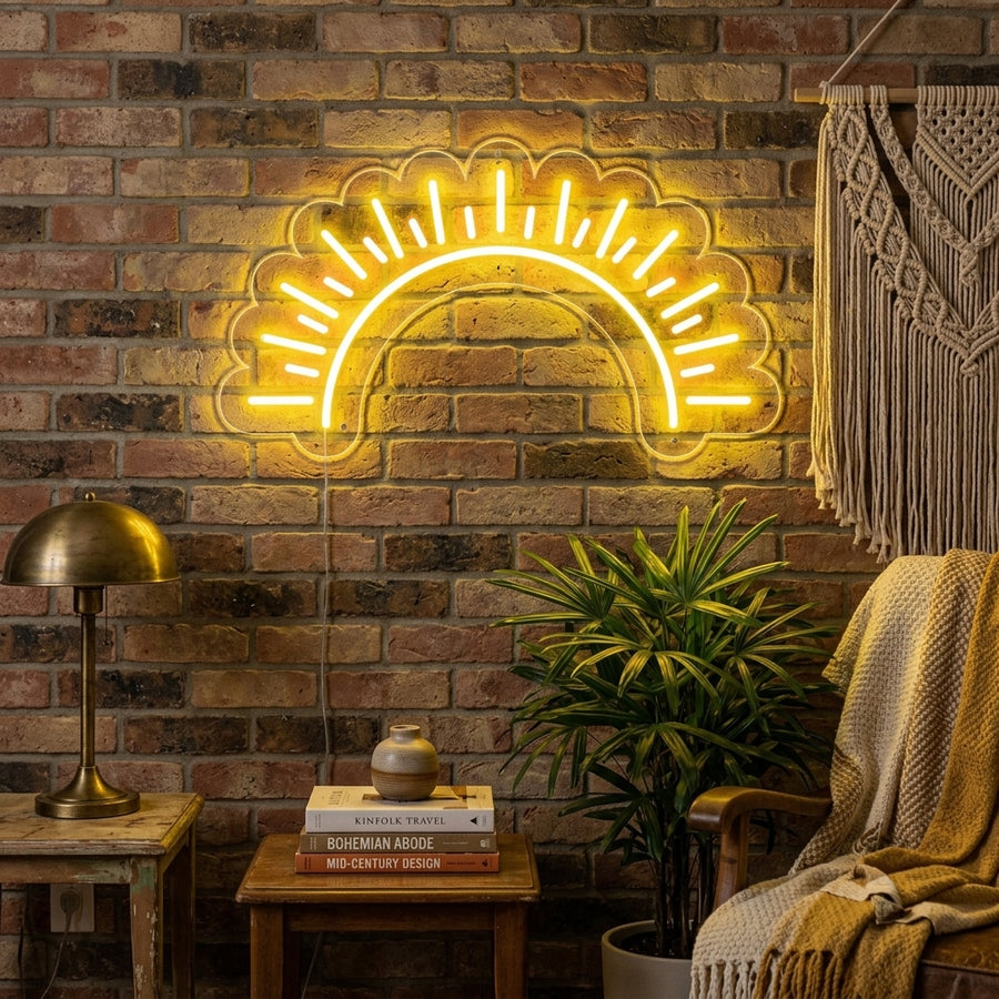 "Sun Sunset" glowing neon sign mounted above a textured sofa in a stylishly decorated room.