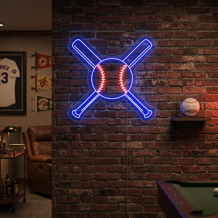 A glowing neon sign featuring two crossed baseball bats and a baseball in the center, mounted on a rustic wood plank wall in a home bar area.