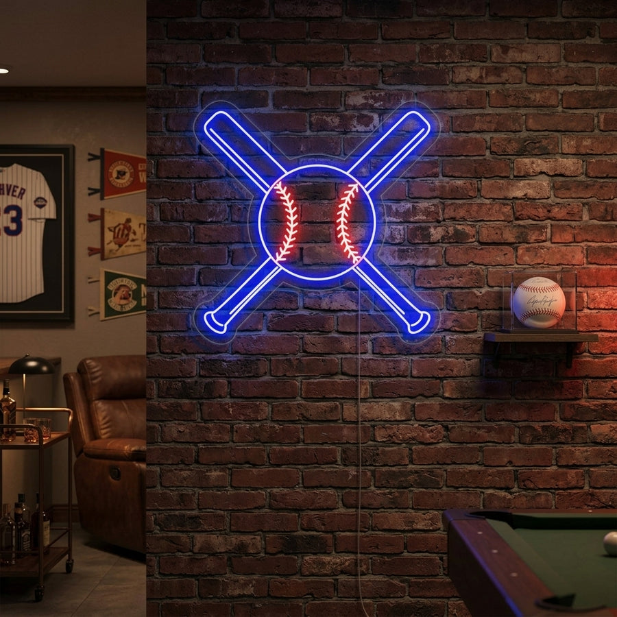 A glowing neon sign featuring two crossed baseball bats and a baseball in the center, mounted on a rustic wood plank wall in a home bar area.