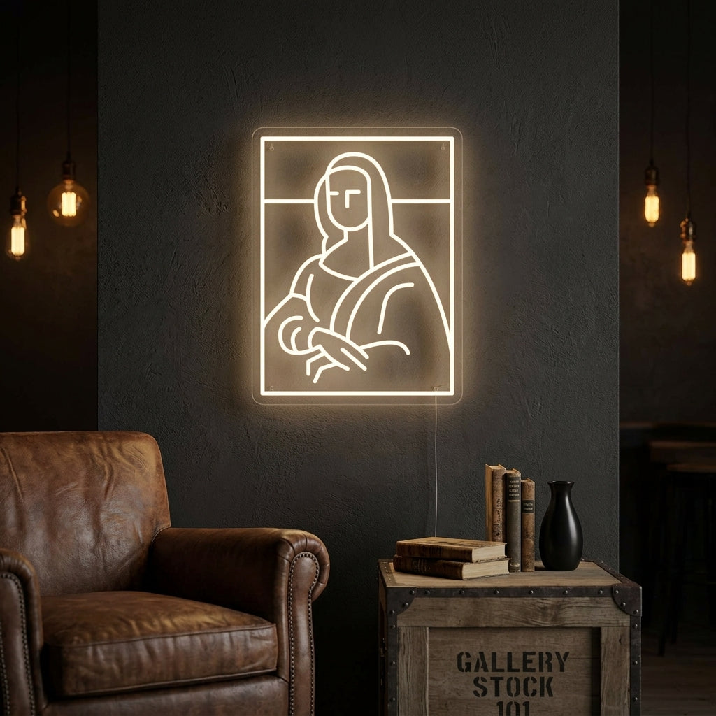 The glowing Mona Lisa neon sign in white and yellow tubing is mounted on a textured brick wall, casting warm light. Below it is a plush armchair and a small table with an open art book, creating a cozy and artistic atmosphere.