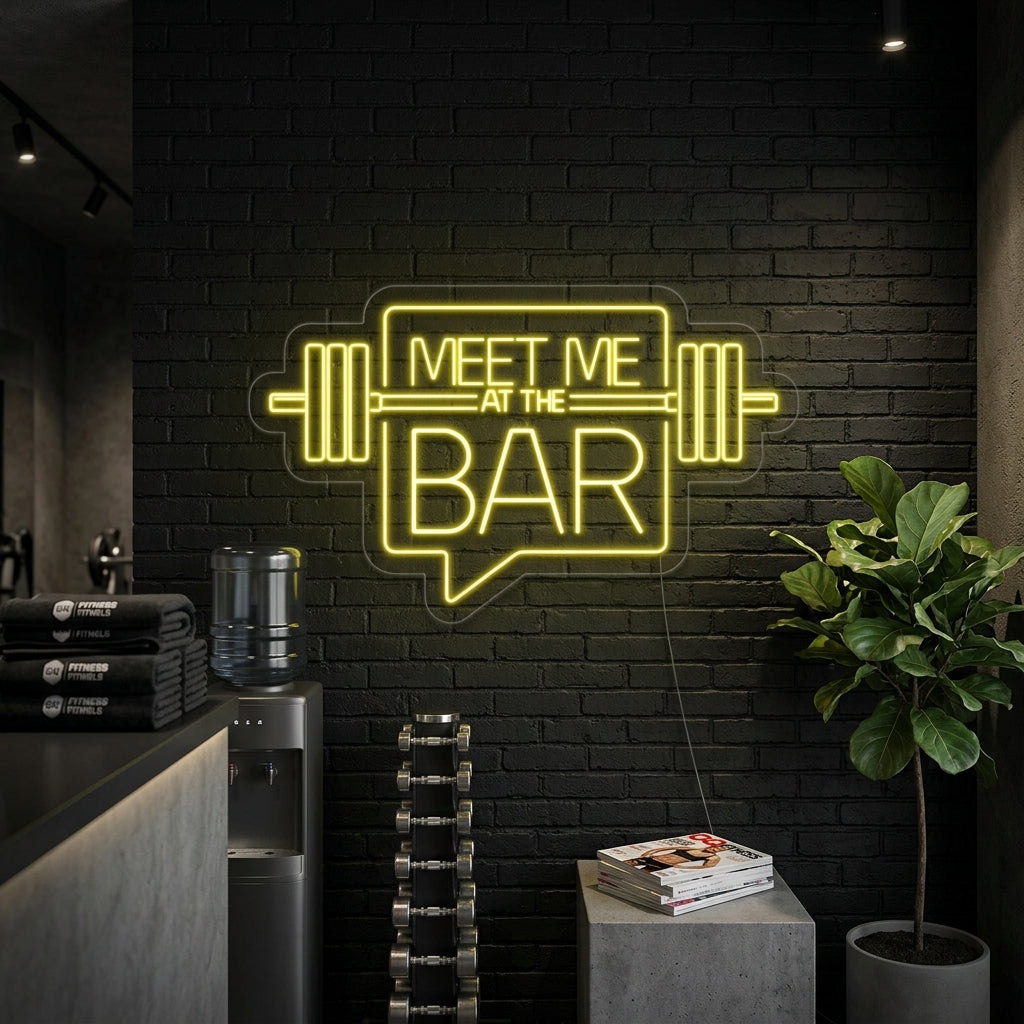 A vibrant 'Meet Me At The Bar' neon sign mounted on a brick wall in a home gym setting.