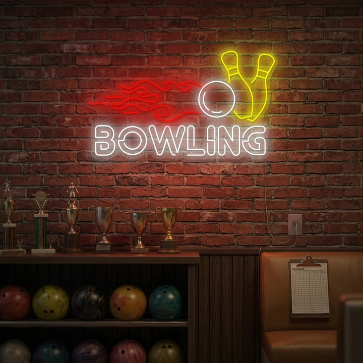 A glowing blue neon sign depicting a bowling ball hitting ten pins on a lane wall above a leather sofa.
