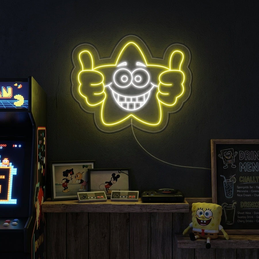 A vibrant 'Good Job Star' neon sign glowing brightly on an exposed brick wall, radiating warm light in a modern creative space.