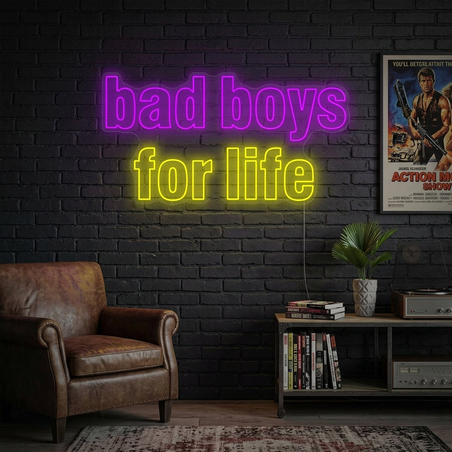 A vibrant 'Bad Boys For Life' neon sign glows blue in a contemporary, loft-style setting, perfect for movie enthusiasts.