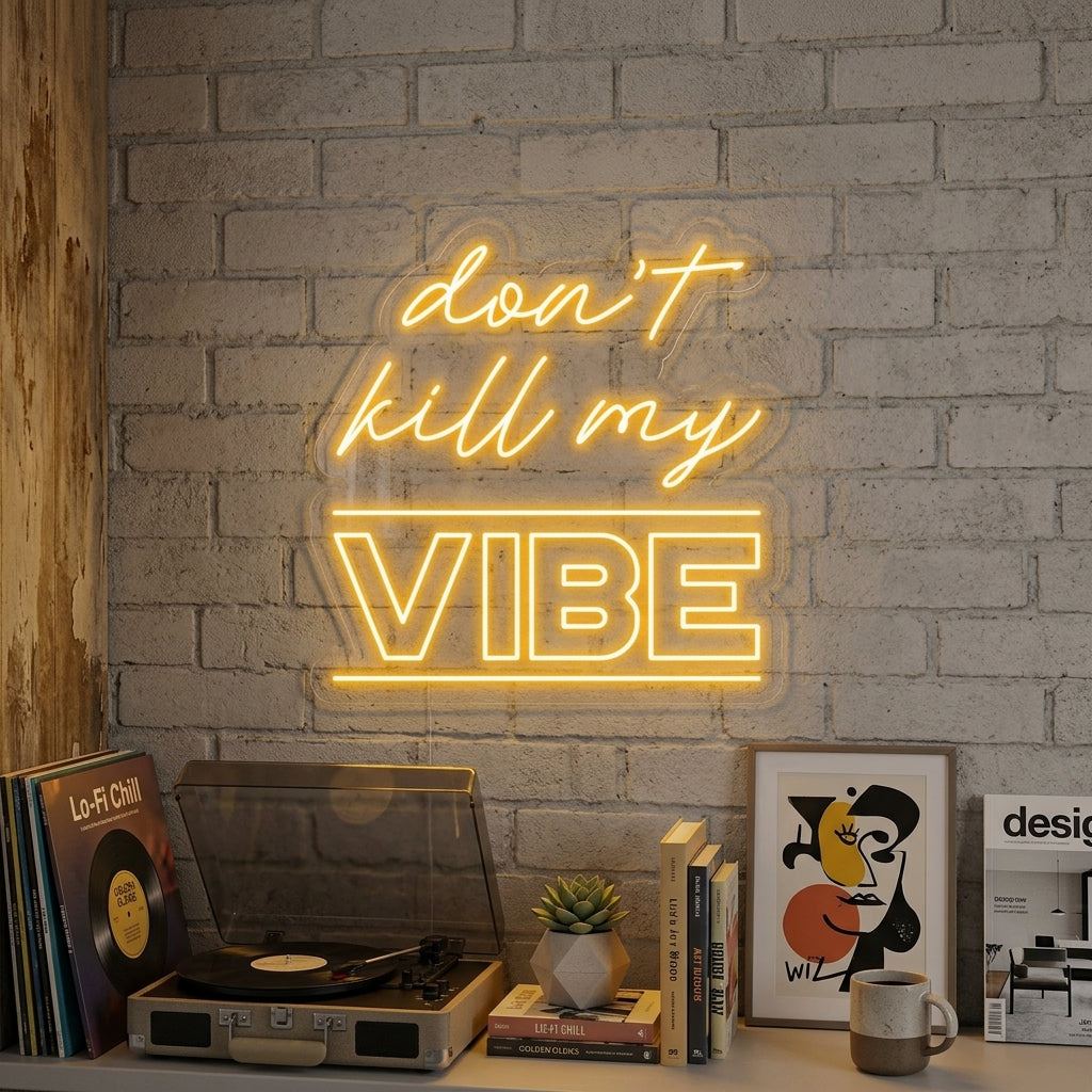 A glowing blue 'Dont Kill My Vibe' neon sign mounted on a textured brick wall above a cozy lounge chair in a modern living room setting.