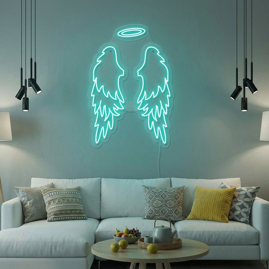 A white neon sign depicting large angel wings with a halo glowing on a bedroom wall.