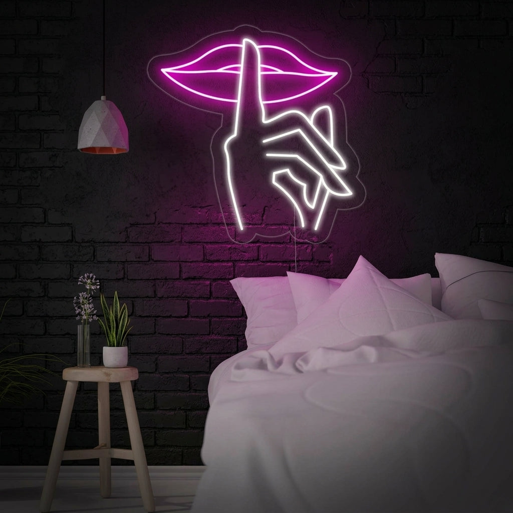 A glowing blue 'Shut Up Lips' neon sign hangs above a made bed in a stylish bedroom, featuring a design of blue lips with the word 'SHUT' and a graphic on the upper lip.