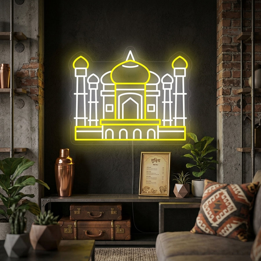 A lifestyle photo showing the glowing 'India Taj Mahal' neon sign mounted on a textured wall in a modern living room setting.
