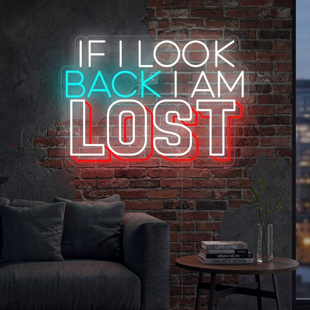 A lit "If I Look Back I am Lost" neon sign mounted on a textured brick wall in a cozy living room, providing warm ambient light.