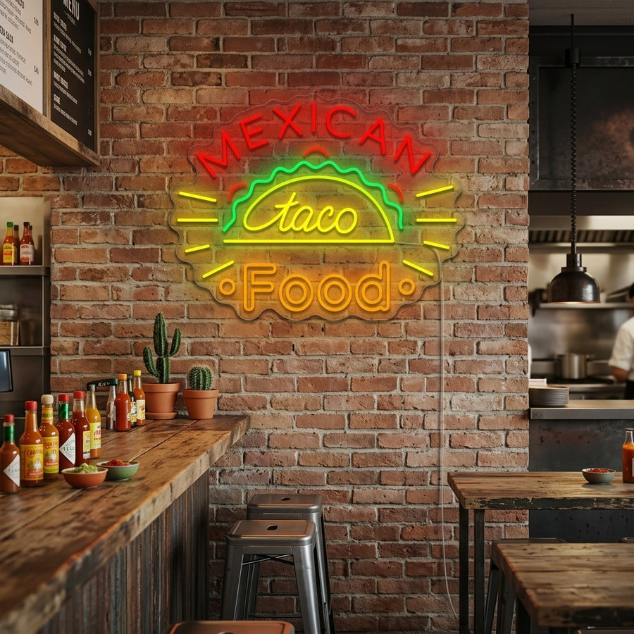 A glowing 'Mexican Taco' neon sign illuminates a decorated restaurant wall, featuring the text 'Mexican Taco' above an illustration of a taco.