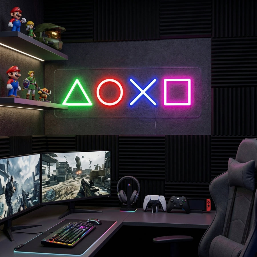 A glowing blue 'PLAY' neon sign with geometric controller icons displayed above a modern gaming desk set up with multiple monitors and a comfortable chair in a dimly lit room.