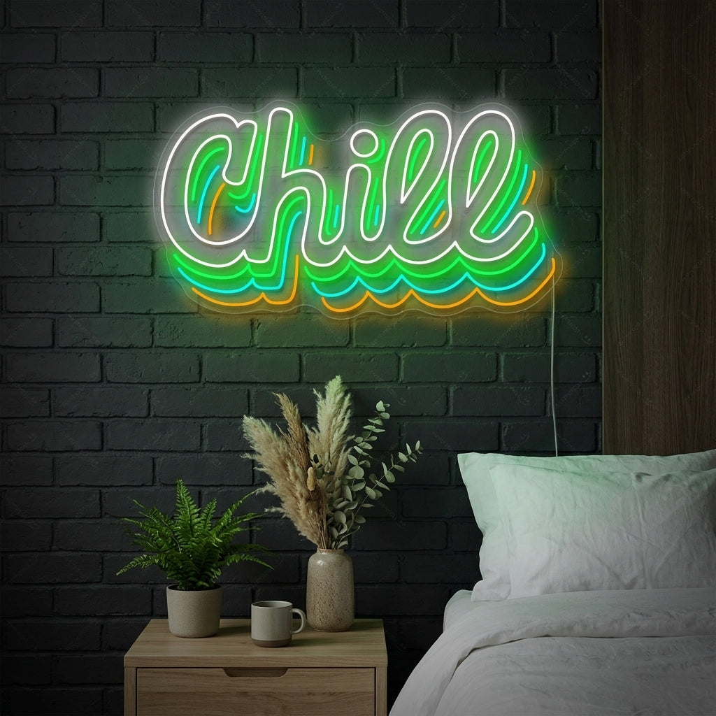 A lifestyle photo showing a flowing blue script "Chill" neon sign illuminated on a textured living room wall above a modern grey sofa.