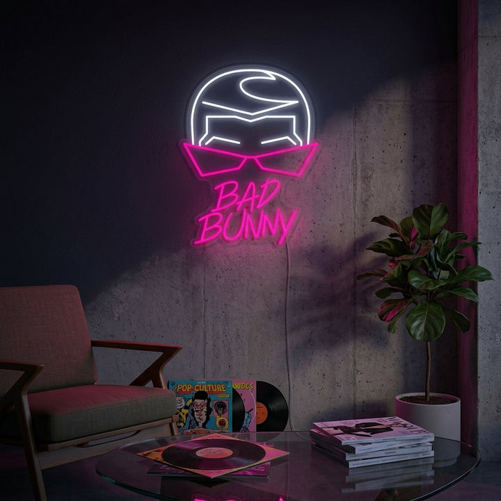 Bad Bunny Singer Rapper neon sign glowing with colorful light in a modern room setting.