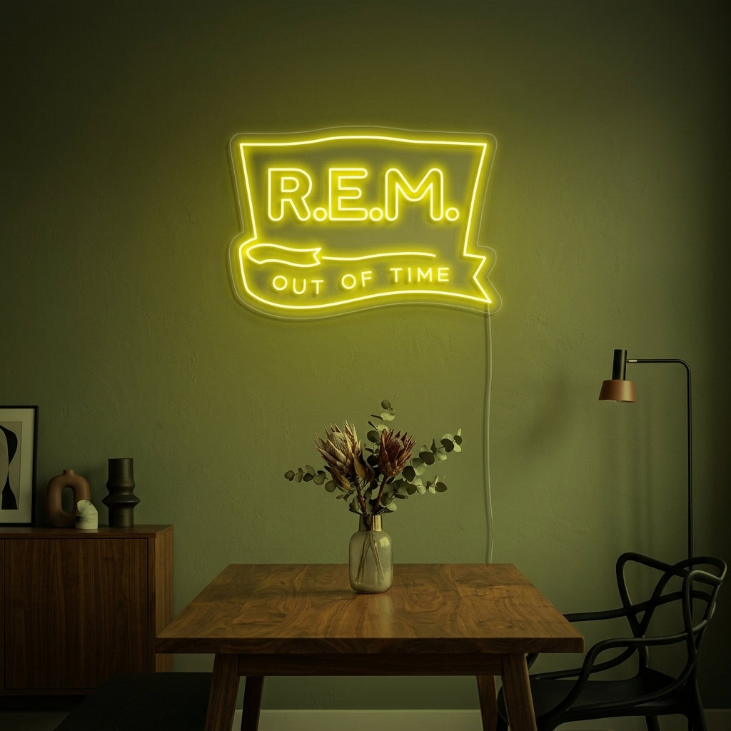 A stylishly lit R-E-M neon sign glowing brightly on a textured wall within a contemporary living room setting.
