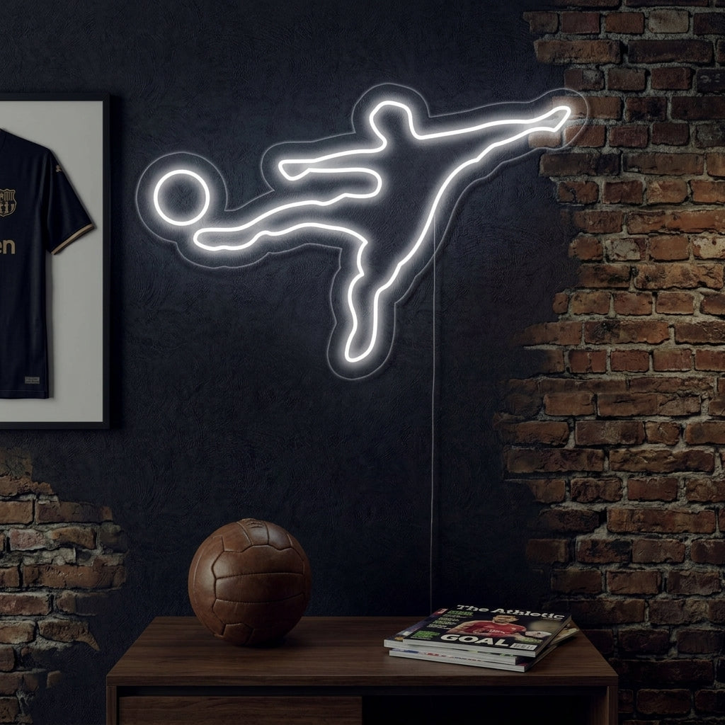 A glowing 'Soccer Player' neon sign depicting an athlete in motion, mounted on a rustic brick wall in a bedroom or game room setting.