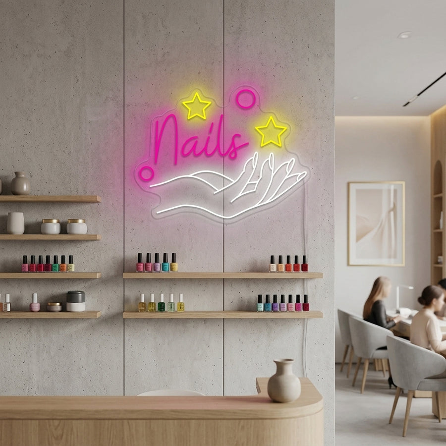 A stylish 'Nail Salon' neon sign illuminated on a wall in a modern nail bar setting, casting a vibrant blue and pink glow.