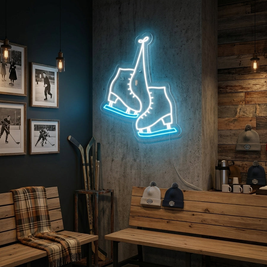 A glowing 'Skate Shoes' neon sign showing two high-top sneakers, mounted above a couch in a modern room.