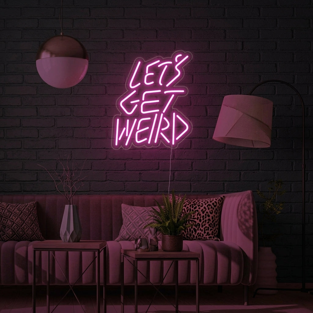 A vibrant green 'Lets Get Weird' neon sign illuminates a cozy living room, mounted on a brick wall above a stylish velvet sofa.