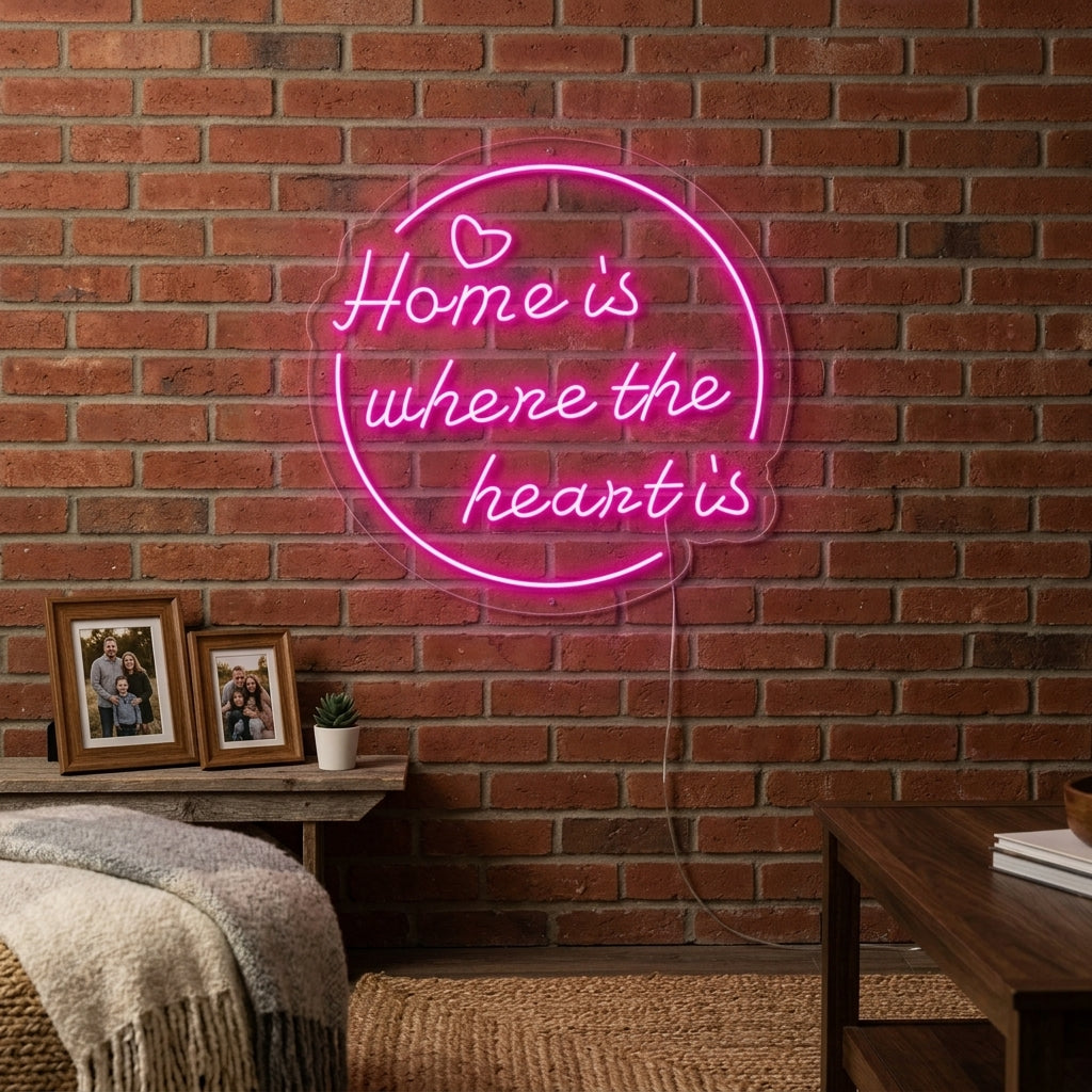 A cozy living room setting with the glowing neon sign reading 'Home is Where The Heart is' mounted on a textured wall above a sofa.