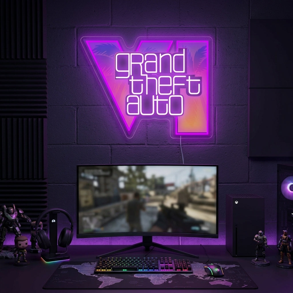 Grand Theft Auto neon sign glowing above a modern gaming desk with dual monitors in a dim room.