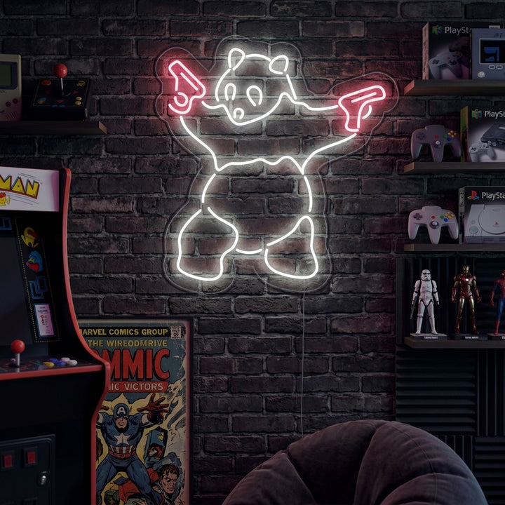 A vibrant neon sign featuring a panda holding a gun, mounted on a wall above a desk.
