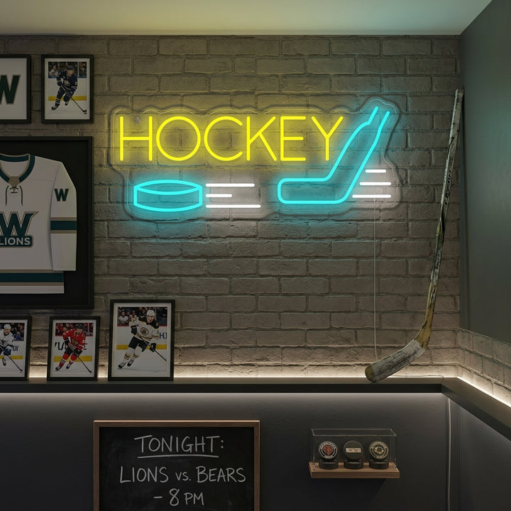A hockey neon sign featuring an illuminated player figure in an action pose with stick and puck, glowing blue, against a backdrop of a brick wall and various hockey memorabilia in a well-lit room.