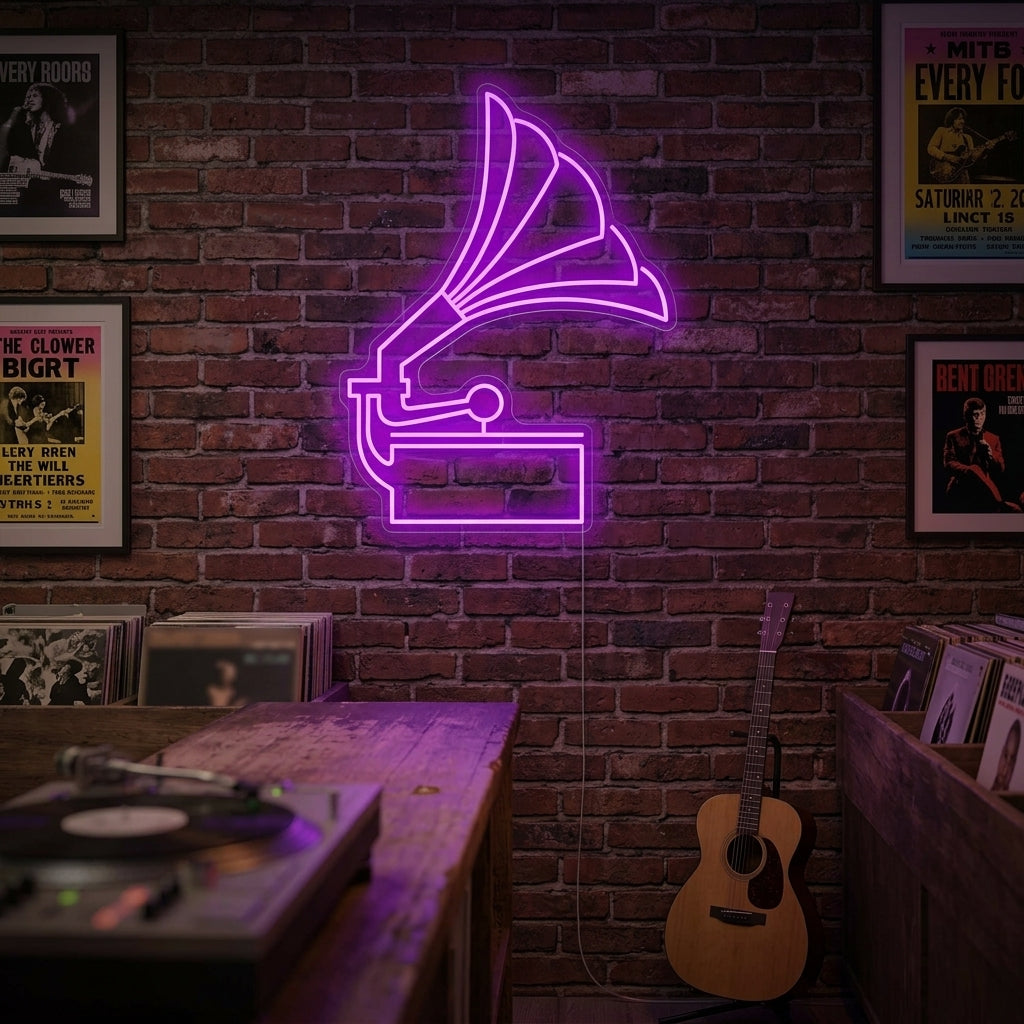 A glowing warm white and orange neon sign shaped like a vintage gramophone mounted on a dark textured brick wall above a record player setup.