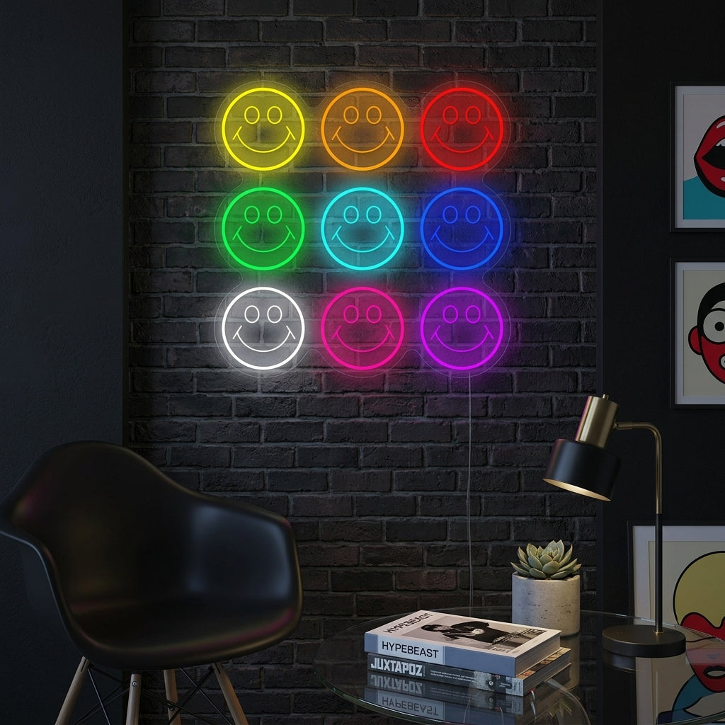 A vibrant 'Smile' emoji neon sign glowing yellow in a cozy living room, mounted on a wall above a modern desk and plant.