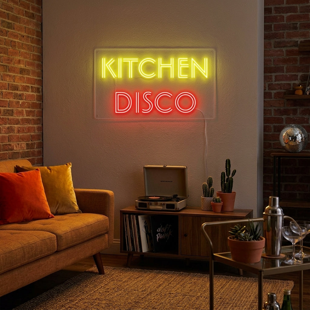 A "Kitchen Disco" neon sign glowing brightly on a wall in a modern kitchen setting.
