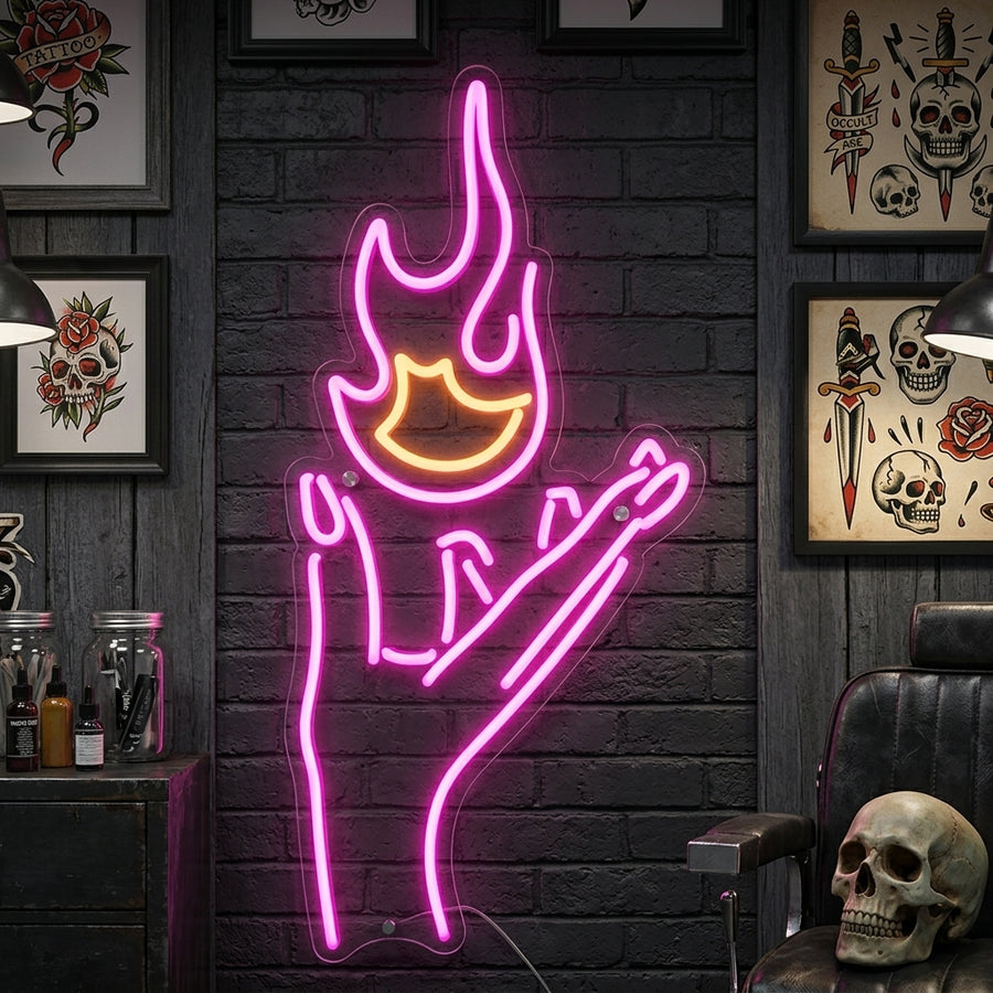 The 'Fire and Hand' neon sign, glowing with orange and blue light, displayed on a textured dark blue wall in a modern living room setting.