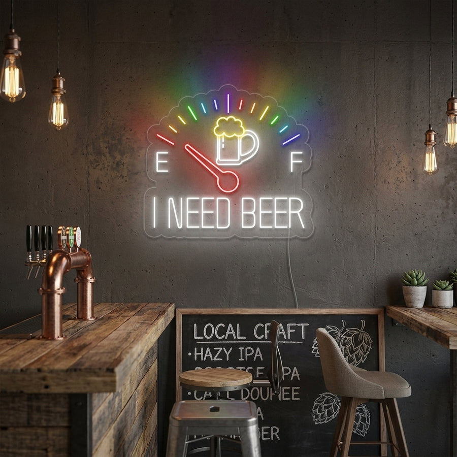 Lifestyle image of the lit 'I Need Beer' clock neon sign on a brick wall above a well-stocked bar counter.