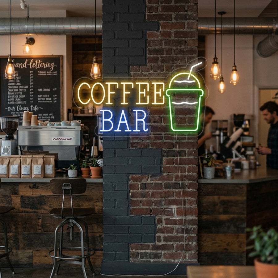 Illuminated 'Coffee Bar with Coffee Cup' neon sign displayed on a rustic brick wall in a cozy cafe setting, highlighting the warm glow and modern design.