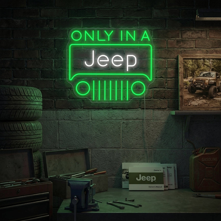 A vibrant 'Only in a Jeep' neon sign glowing on a garage wall, featuring a yellow Jeep logo above the text.