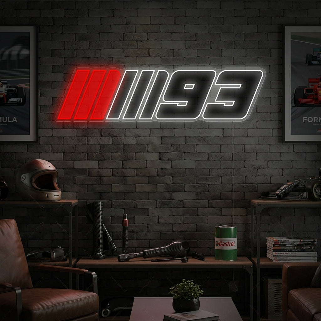 Marc Marquez 93 Race Logo neon sign glowing in a modern garage setting, showcasing the red number and white text on a wall above a workbench.