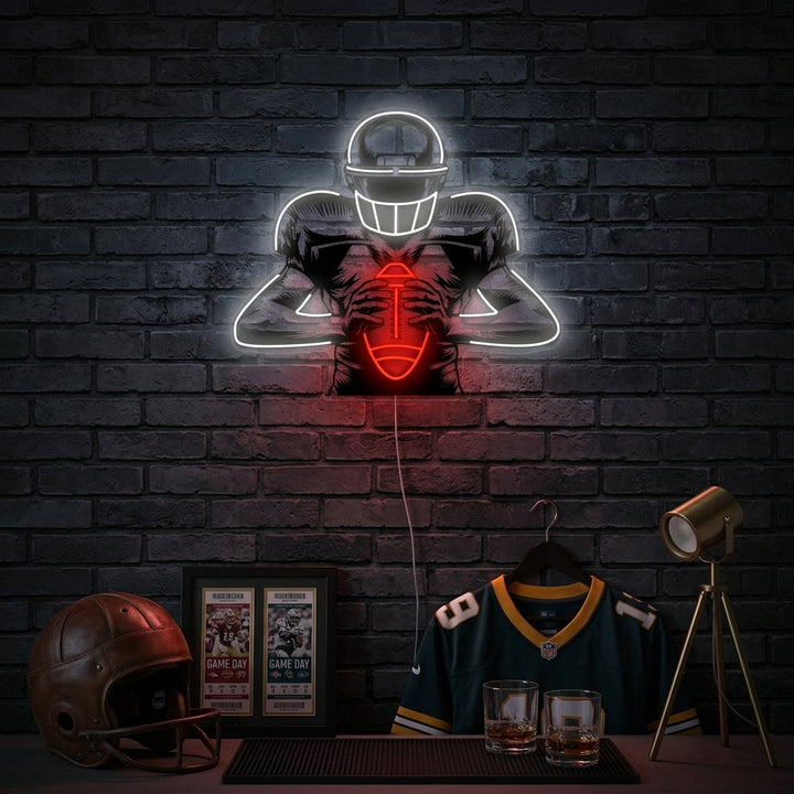 A lifestyle shot of the American Football Player neon sign glowing blue on a textured grey wall in a contemporary living room.