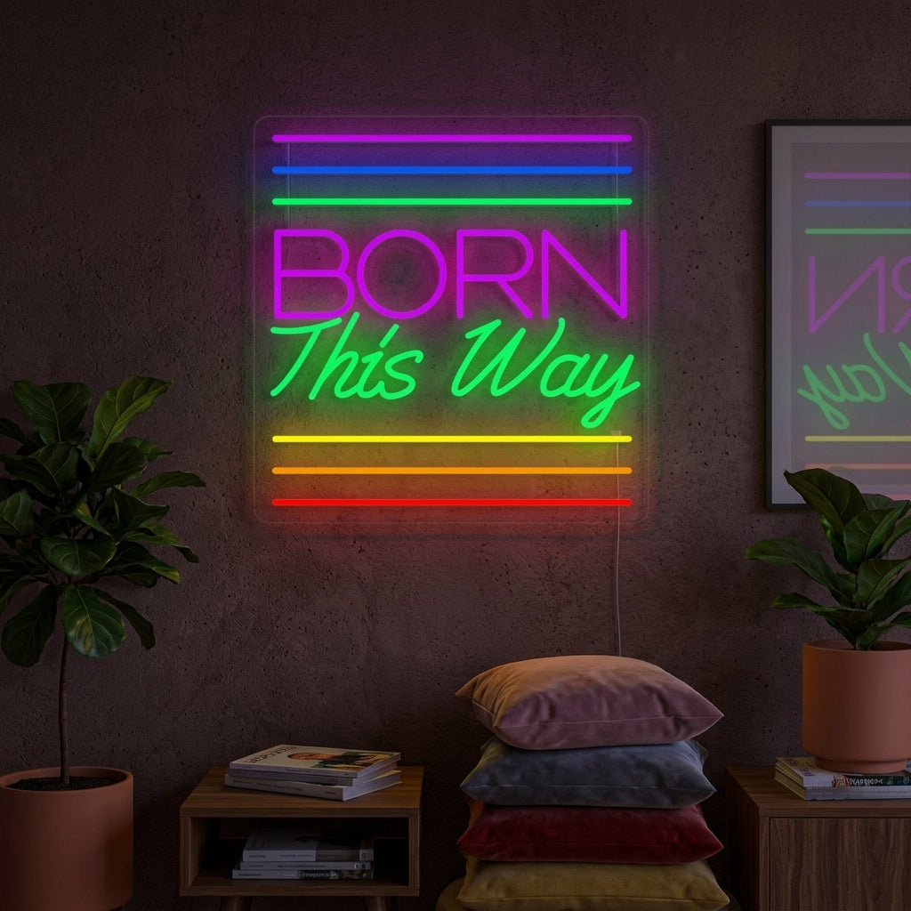 Vibrant "Born This Way" neon sign illuminated in rainbow colors on a living room wall